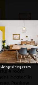 a living room with a dining room element located in a hallway at Helenas place in Berlin