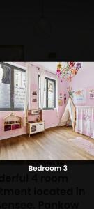 a bedroom with pink walls and a room with a tent at Helenas place in Berlin