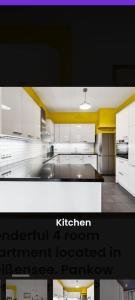 a kitchen with white cabinets and a kitchen instrument located in at Helenas place in Berlin