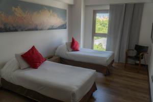 Cama ou camas em um quarto em Mod Hotels Mendoza