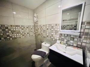 Koupelna v ubytování Hotel Dlima Inn Bukit + 14 fotografií