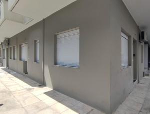 a hallway with a window on the side of a building at GARNET 3 in Kalamata