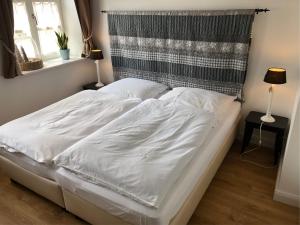 Postel nebo postele na pokoji v ubytování Fachwerkhaus Hartmann