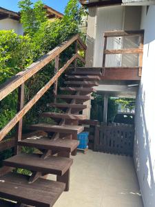 a set of stairs leading up to a house at Mirante da Figueira - Suítes para temporada in Angra dos Reis