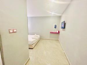 Postel nebo postele na pokoji v ubytování Hotel Dlima Inn Bukit