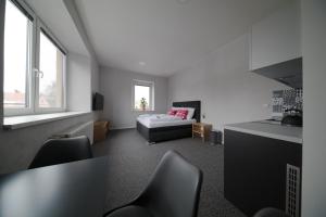 Rúm í herbergi á Replay apartmány