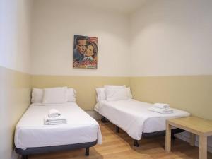 Posteľ alebo postele v izbe v ubytovaní ¡Apartamento en el centro de Barcelona!