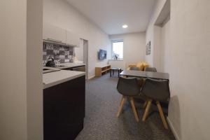 Eldhús eða eldhúskrókur á Replay apartmány