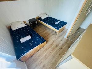 Postel nebo postele na pokoji v ubytování Domek Letniskowy