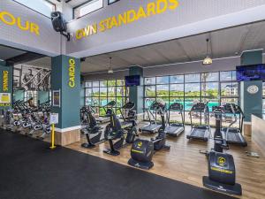 a gym with treadmills and cardio equipment in a building at 5 The Blyde Crystal Clear 2 Bedroom Apartment in Pretoria