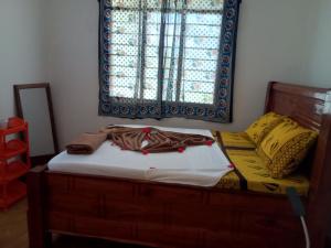 Postel nebo postele na pokoji v ubytování Magharibi House