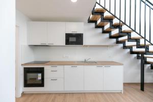 Kuchyň nebo kuchyňský kout v ubytování Mezonet - Postovska Centr Apartments