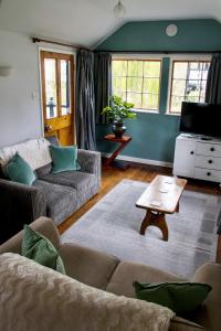 a living room with two couches and a coffee table at Bath Boating Station in Bath