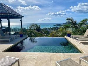 a swimming pool with a view of the ocean at Lookout in Bolans