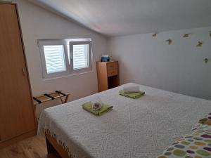 Postel nebo postele na pokoji v ubytování Apartmani Gojko