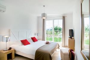 Postel nebo postele na pokoji v ubytování Lagrange Vacances - Le Clos Savornin