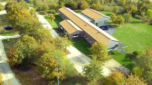 an overhead view of a large house with a roof at Chalet nature proche lac et à 20 mn des plages en Vendée in La Chapelle-Hermier