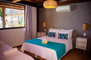 Bamboo Búzios Hostel客房内的一张或多张床位