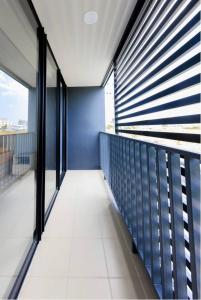 an empty balcony of a building with windows at PT Residence Bearing in Bangna