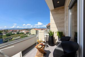 a balcony with a view of a city at Luxury apartment N in Zadar