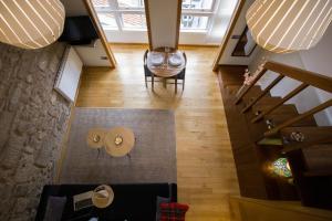 an overhead view of a living room with a table and chairs at Apartamentos Turísticos Pacios in Santiago de Compostela