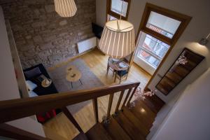 an overhead view of a living room with a stair case at Apartamentos Turísticos Pacios in Santiago de Compostela
