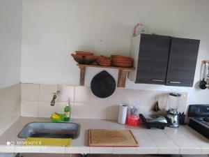 a kitchen with a sink and a counter top at Cabaña villa lola in San Gil