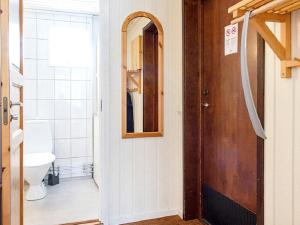 a bathroom with a toilet and a door at 4 person holiday home in S LEN in Sälen