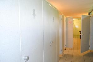 a hallway with a shower stall in a bathroom at Munich Central Camping in Munich