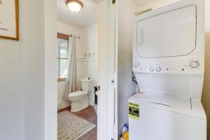 a white refrigerator in a bathroom with a toilet at Private Hot Tub and Fire Pit Pocono Lake House! in Pocono Lake +29 photos