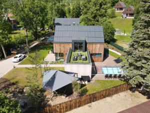 an aerial view of a house with a pool at Rezidence Za Vodou - Ledňáček in Černý Dŭl