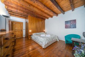 מיטה או מיטות בחדר ב-Atelier San Giacomo - Central Apartment