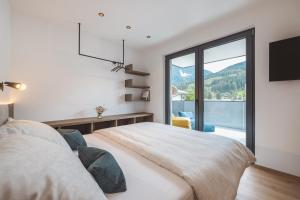 Posteľ alebo postele v izbe v ubytovaní Thalhof Apartments