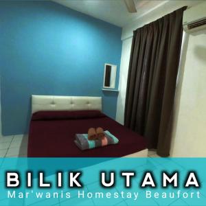 Un pat sau paturi într-o cameră la Mar'Wanis Homestay Beaufort Sabah