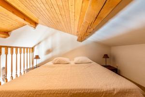Postel nebo postele na pokoji v ubytování La Rose des Vents & Spa - Gite Savane