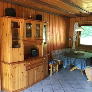 a room with a table and a dining room at Ferienhaus Am Wäldchen in Weiskirchen