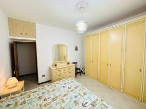 Postel nebo postele na pokoji v ubytování Tritone - Immobilevante
