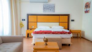 En eller flere senge i et værelse på Platanus Hotel Altınoluk