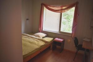 Postel nebo postele na pokoji v ubytování Metsa Hostel