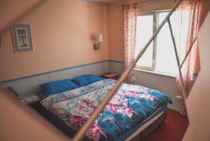Postel nebo postele na pokoji v ubytování Metsa Hostel