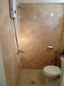 a bathroom with a shower with a toilet and a shower at Popi' s apartment 50 metres from the sea! in Sozopoli