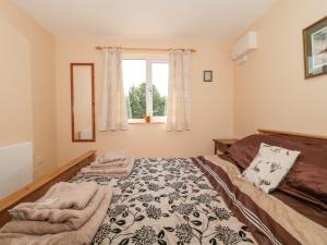 Postel nebo postele na pokoji v ubytování Watermead Lodge