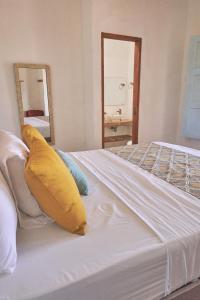 Uma cama ou camas num quarto em Casa Pumata Barichara