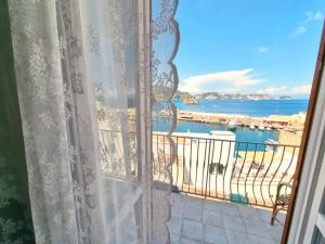a window with a view of the ocean at Maridea - Corso Umberto in Ponza