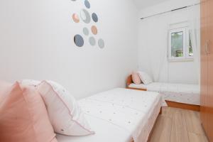 Postel nebo postele na pokoji v ubytování Apartment Petra