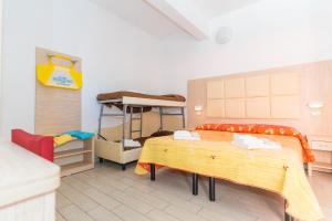 Llit o llits en una habitació de Hotel Croce Del Sud