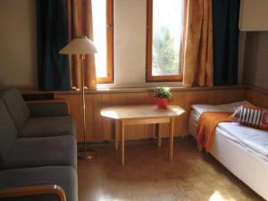 Ein Bett oder Betten in einem Zimmer der Unterkunft Aapiskukko Hotel