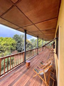 A balcony or terrace at Villa calme - Jardin Tropical - Kpalimé