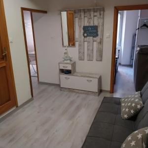a living room with a couch and a table at ANFORA HOUSE in Genoa