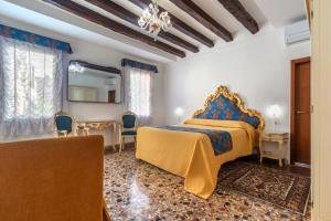מיטה או מיטות בחדר ב-Hotel Casa Boccassini